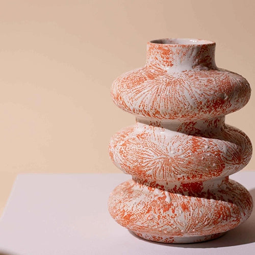 Burnt orange tri-ring flower vase for stylish interiors

