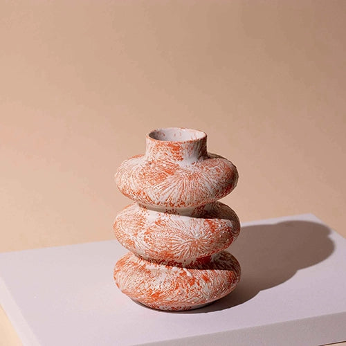 Artistic ceramic vase with a distinctive three-ring design

