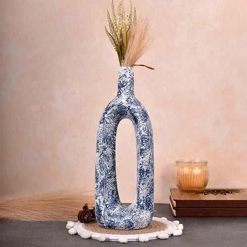 Ceramic blue hollow flower vase with modern sculptural design

