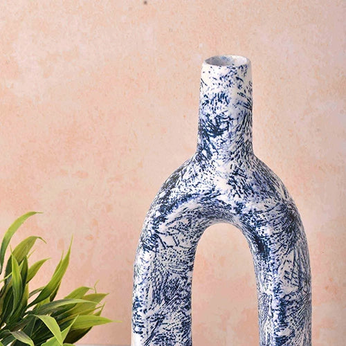 Minimalist blue hollow vase for contemporary home decoration

