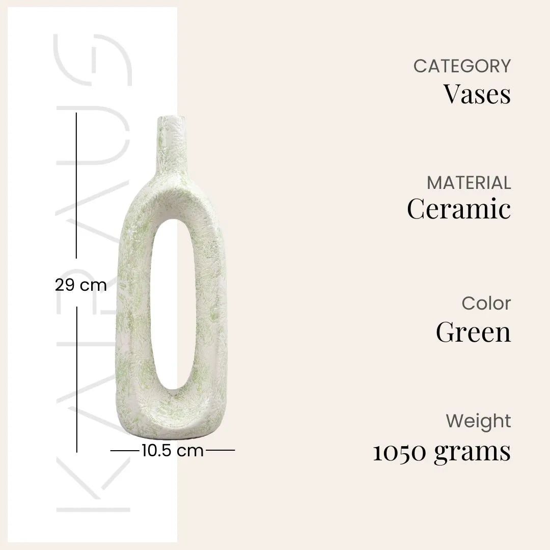 Decorative pastel green flower vase featuring a unique hollow shape

