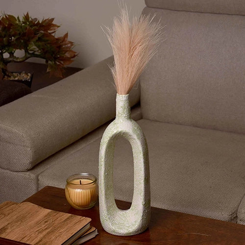 Artistic hollow flower vase in a soft pastel green finish

