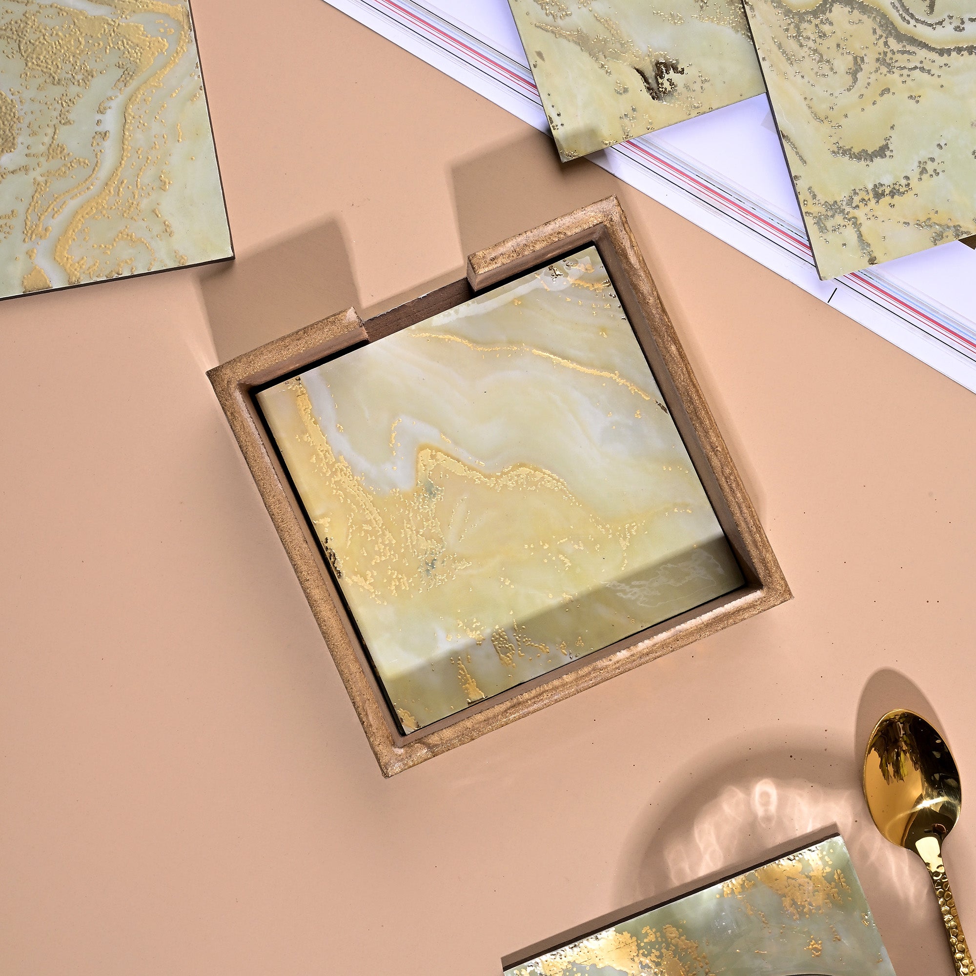 Chic gold foil coasters arranged together

