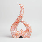Elegant ceramic vase featuring coral and white colors

