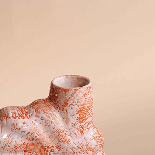 Coral blush flower vase with intricate shell detailing

