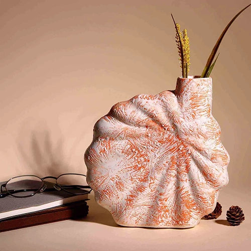 Modern coral blush flower vase with textured shell design

