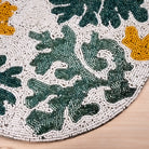 Handmade beaded placemat with coral design
