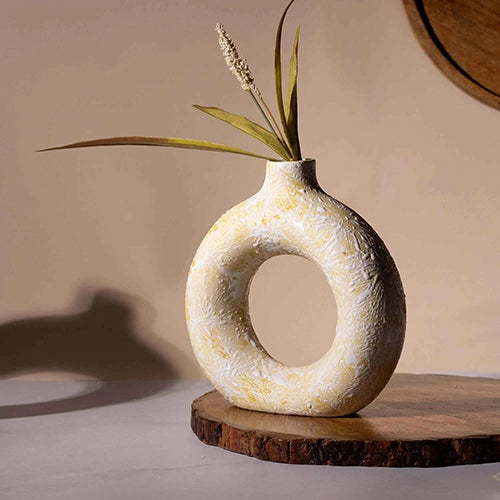 Cream donut ring vase with modern sculptural design

