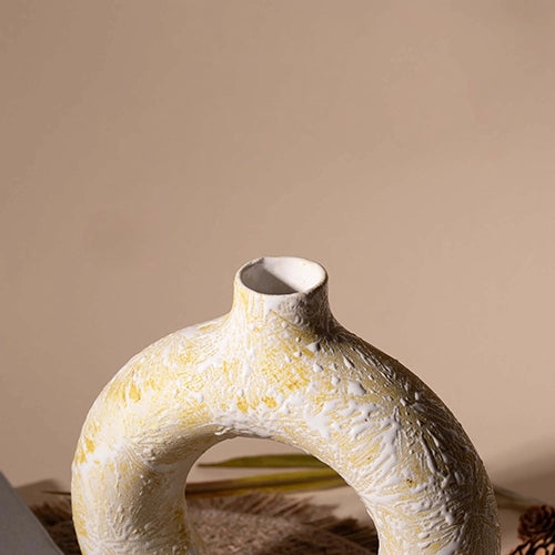 Decorative cream donut vase for stylish interiors

