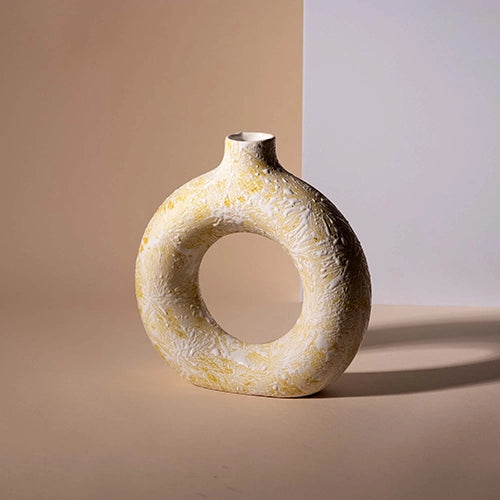 Contemporary donut ring vase in a soft cream finish

