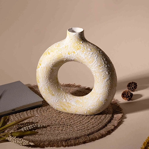 Artistic cream ring-shaped flower vase for interior decor

