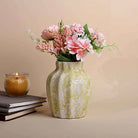 Cream scalloped textured vase with elegant decorative design

