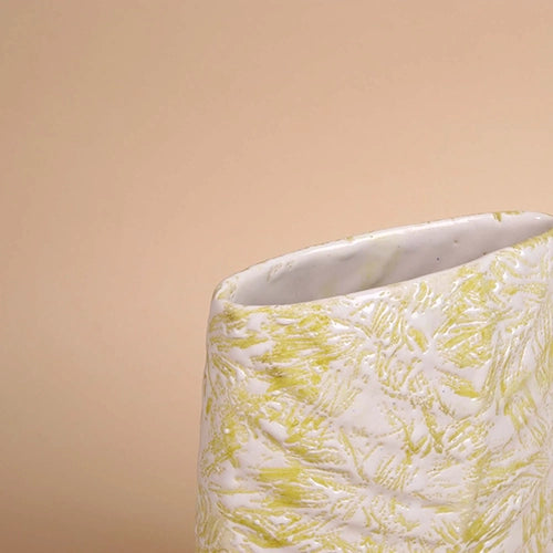 Leaf imprint flower vase in a soft cream finish

