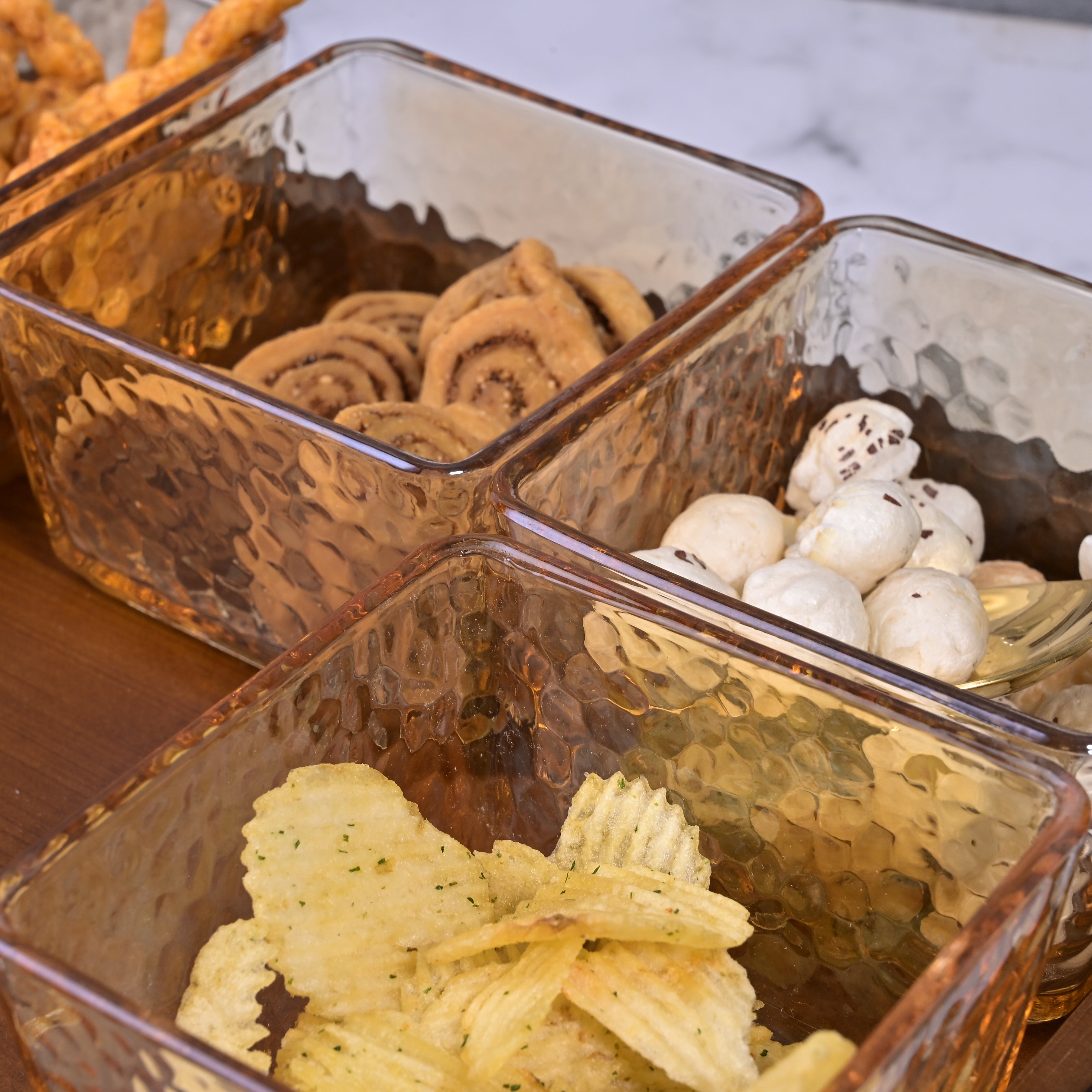 Dazzling glass bowls arranged on decorative tray

