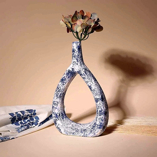Decorative deep blue vase with a unique triangular shape

