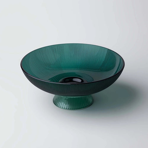 Decorative green glass bowl for serving fresh fruits

