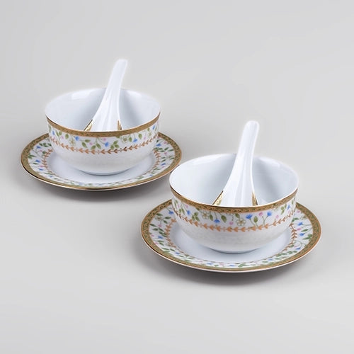 Decorative porcelain bowls with matching spoons for serving

