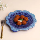 Decorative navy blue serving platter with embroidery design

