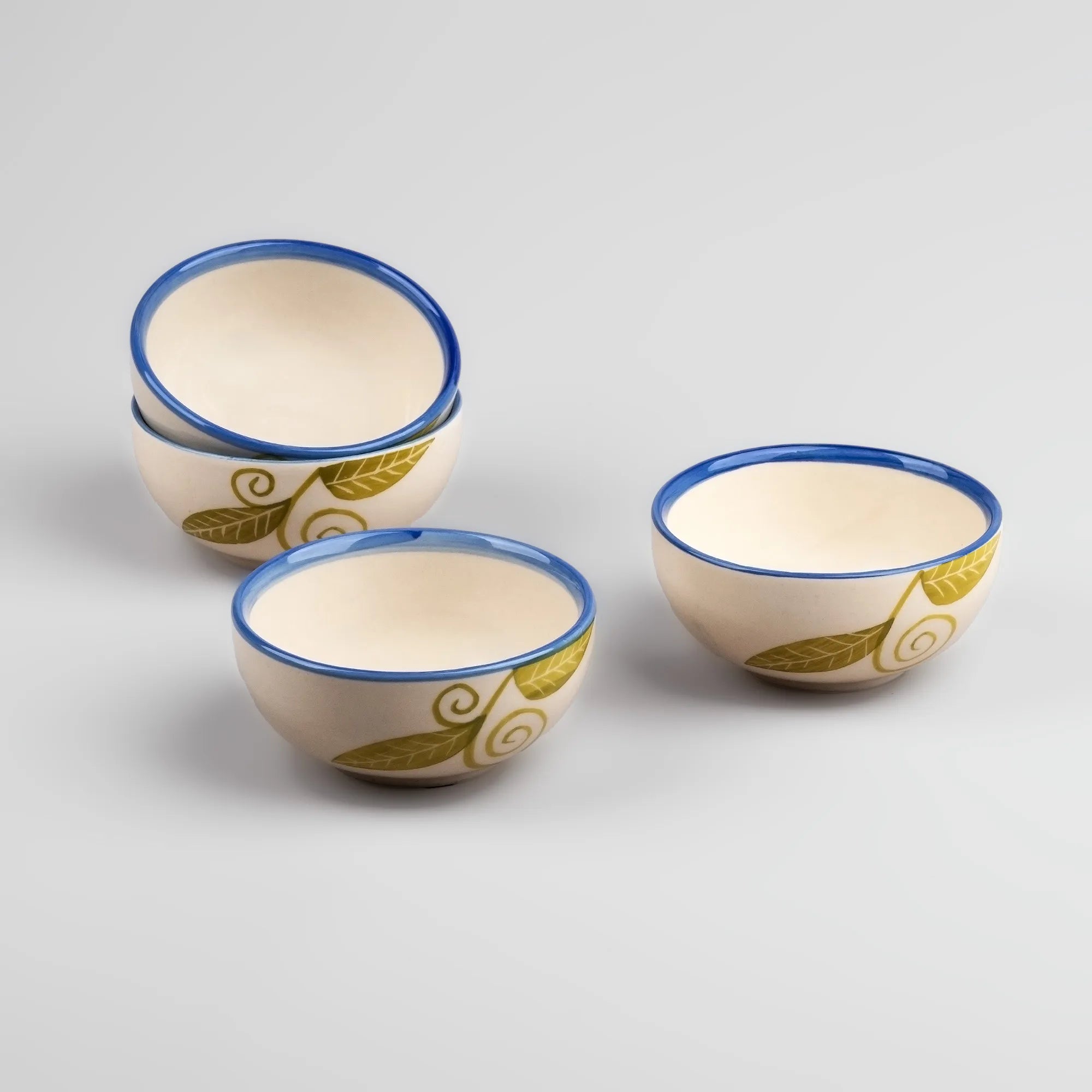 Set of four blue toned ceramic bowls


