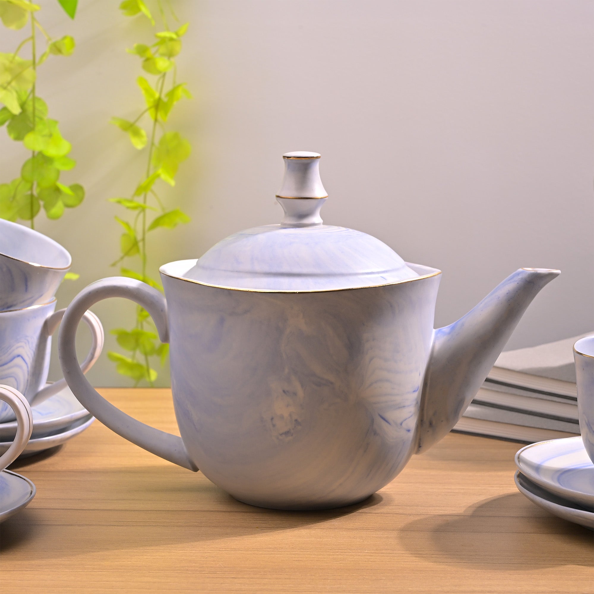 Blue tea kettle and teacup set

