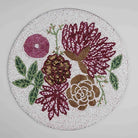 Handcrafted floral beaded table mat for dining

