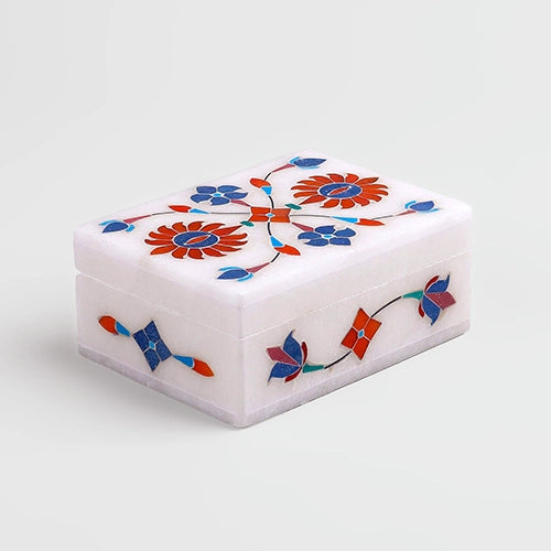 Elegant white marble jewelry box with floral inlay design

