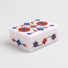 Elegant white marble jewelry box with floral inlay design

