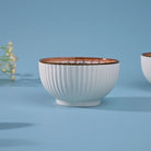 Unique ribbed porcelain bowls with flower-inspired design

