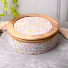Handcrafted wooden casserole with elegant floral detailing

