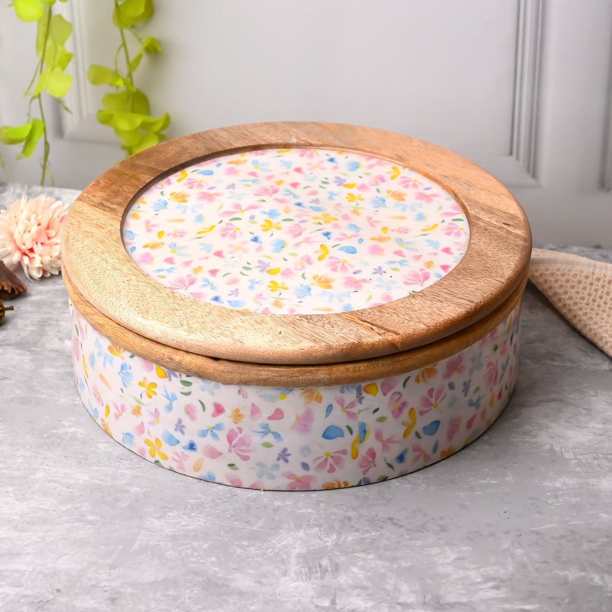 Handcrafted wooden casserole with elegant floral detailing

