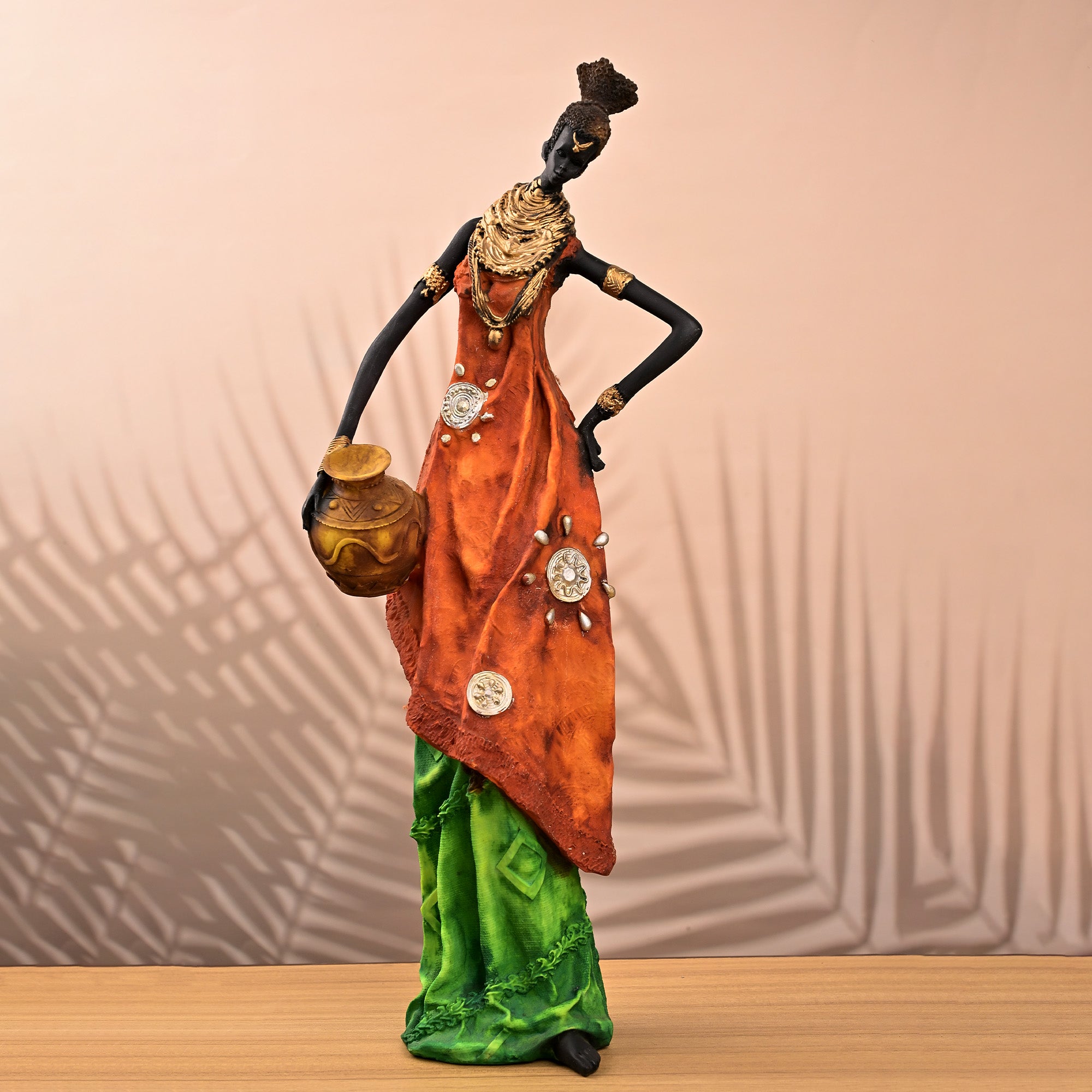 Golden ethnic woman statue with elegant traditional design

