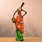 Golden ethnic woman statue with elegant traditional design

