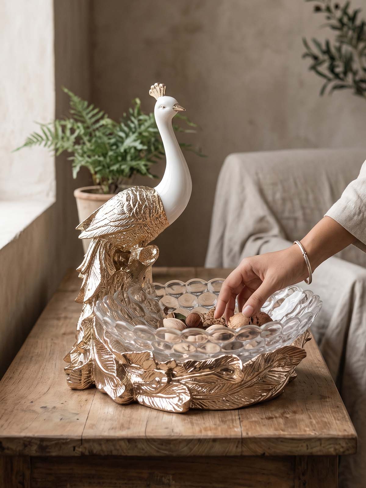 Royal Peacock Fruit Basket featuring an elegant gold feather design

