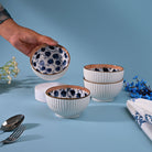 Set of four hand-painted porcelain serving bowls


