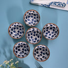 Ribbed porcelain bowls with hand-painted design

