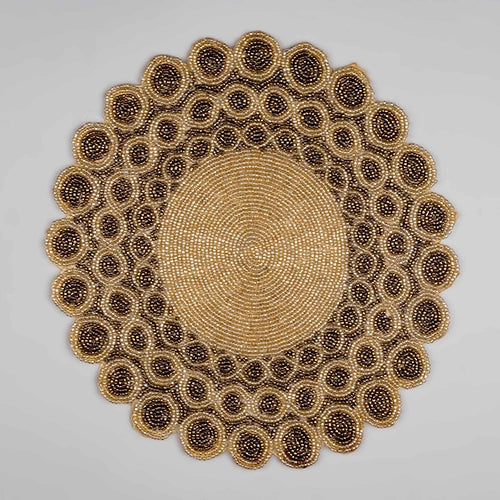 Handmade beaded table mat with decorative detailing

