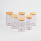Heritage glass jars for kitchen storage with wooden lids
