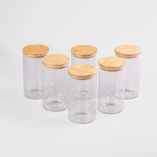 Heritage glass jars for kitchen storage with wooden lids
