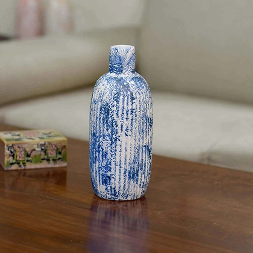 Handcrafted ceramic vase with intricate indigo artwork

