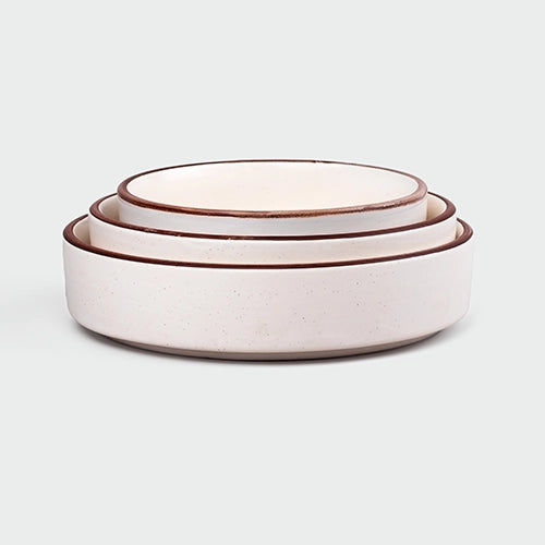 Minimalist ivory bowls for dining and serving

