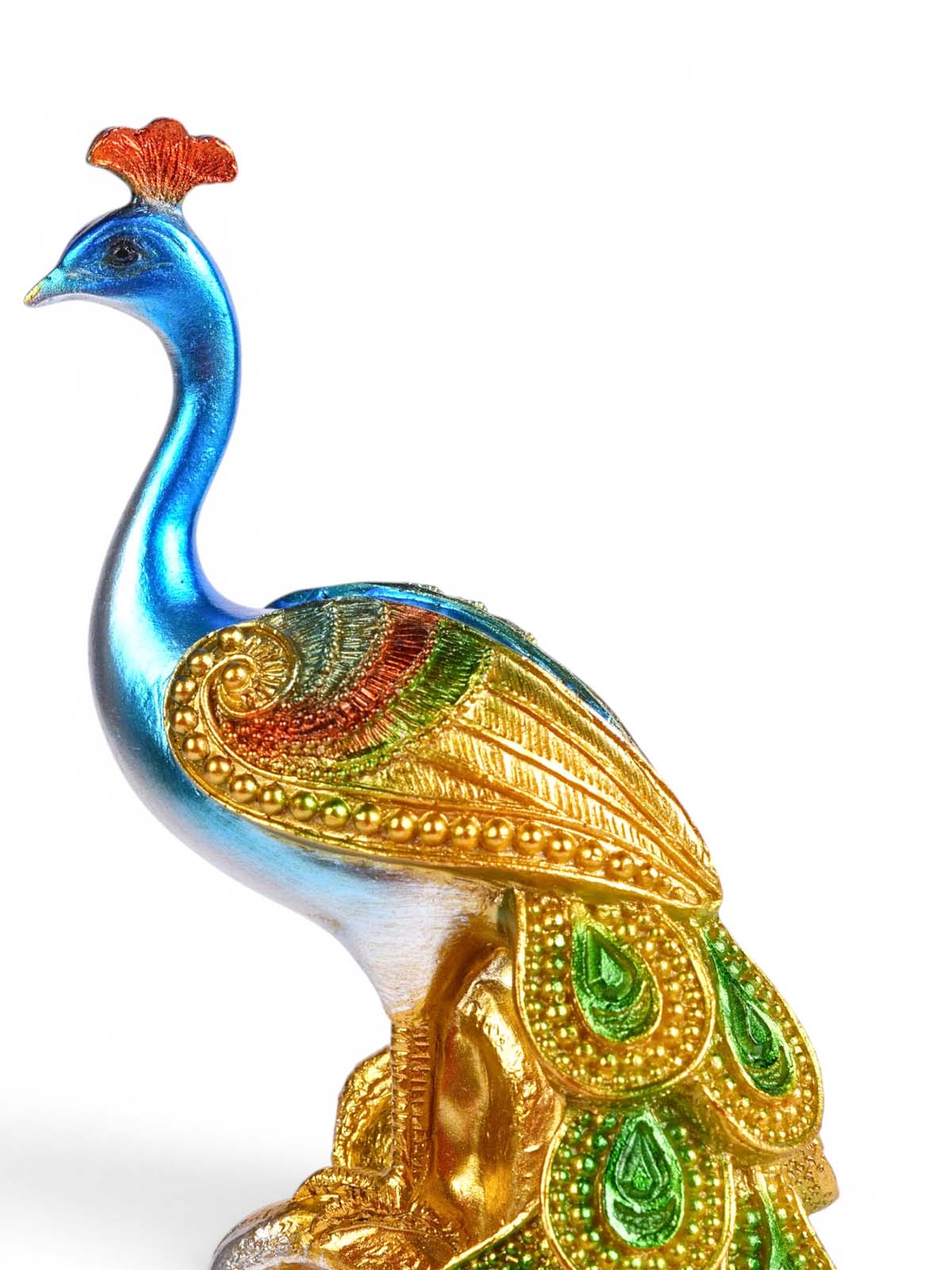 Kalapi Emerald Peacock Tower Figurine showcased in a stylish setting

