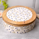Smooth finished casserole with decorative leafy pattern

