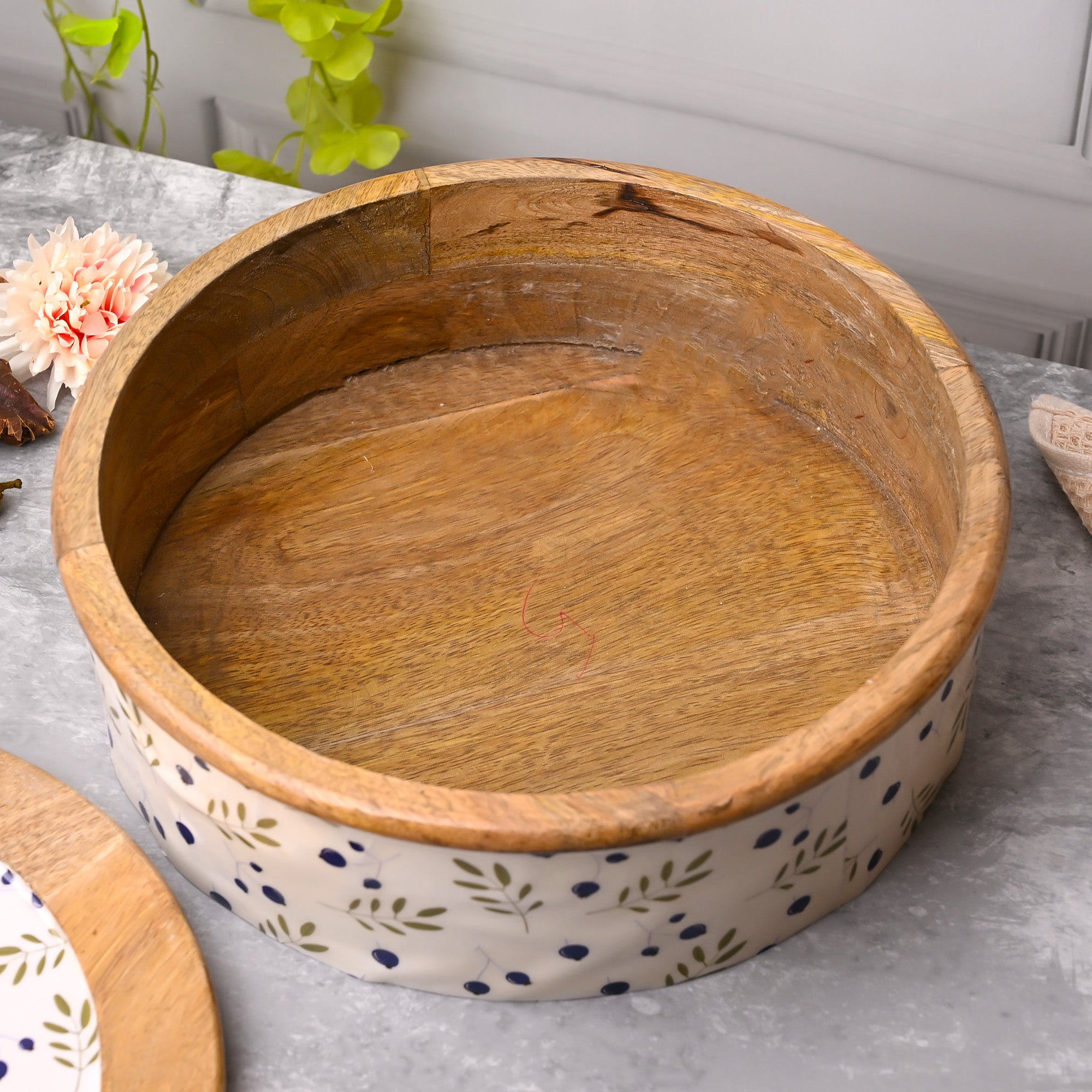 Decorative casserole with smooth finish and leaf motifs

