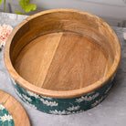 Decorative wooden casserole with lotus-flame artwork

