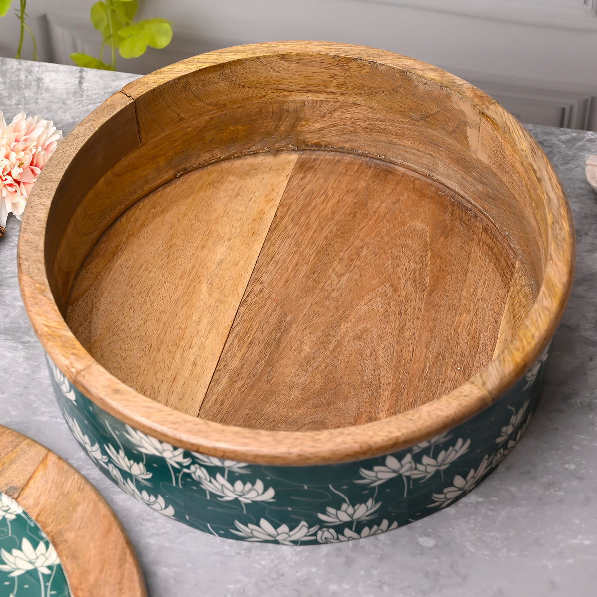 Decorative wooden casserole with lotus-flame artwork

