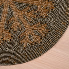 Elegant beaded round placemat for tabletop decor
