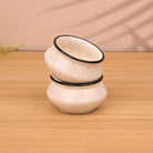 Set of two white and black trim mini dip bowls

