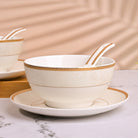Opulent gold-rimmed soup bowls for elegant dining


