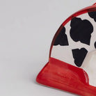 Decorative black and red ceramic tissue dispenser
