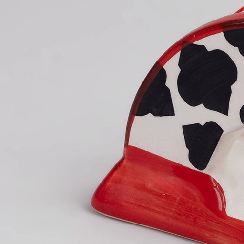 Decorative black and red ceramic tissue dispenser
